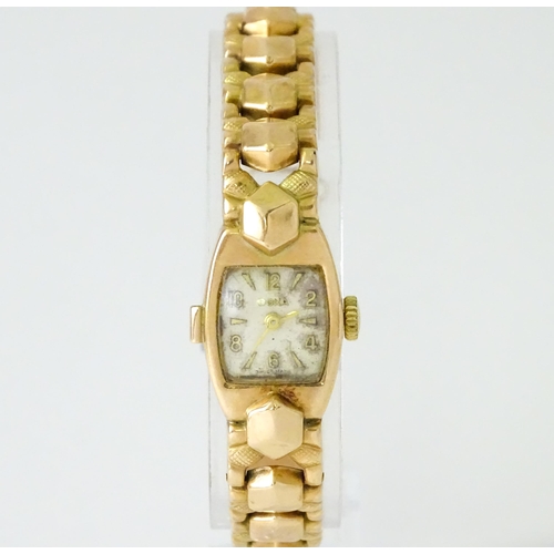 749 - A 14ct gold cased ladies wristwatch by Doxa with 14ct gold strap. Approx. 1/2