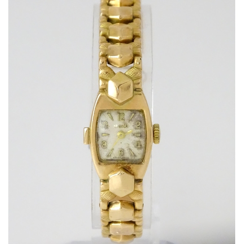 749 - A 14ct gold cased ladies wristwatch by Doxa with 14ct gold strap. Approx. 1/2