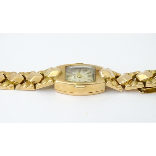 749 - A 14ct gold cased ladies wristwatch by Doxa with 14ct gold strap. Approx. 1/2