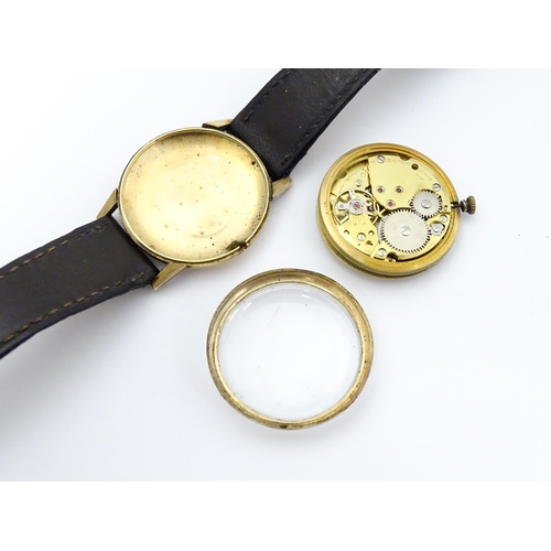 751 - A gentlemans 9ct gold cased Imado wristwatch with hour batons and date aperture, the case hallmarked... 