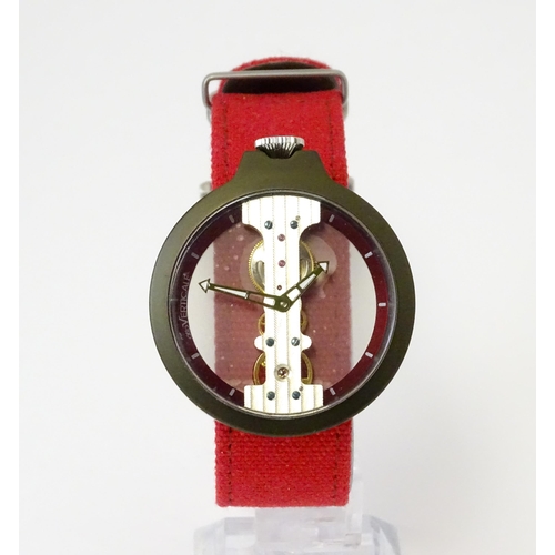 752 - A gentlemans Atto Verticale skeleton wristwatch with red strap. Approx. 1 5/8