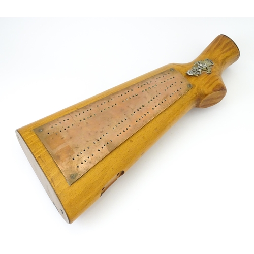 802 - Militaria : a 20thC cribbage board constructed from a gunstock, the top with affixed Royal Electrica... 