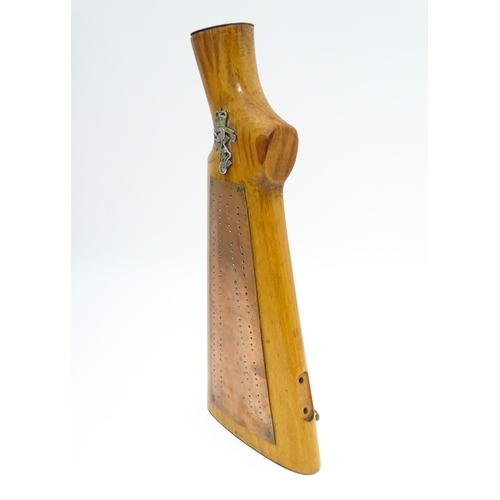 802 - Militaria : a 20thC cribbage board constructed from a gunstock, the top with affixed Royal Electrica... 