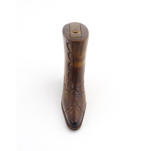 1200 - Treen : A 19thC novelty shoe snuff box of heeled boot form with carved decoration, the sliding lid o... 