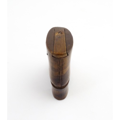 1200 - Treen : A 19thC novelty shoe snuff box of heeled boot form with carved decoration, the sliding lid o... 