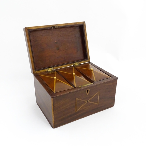 1283 - A 19thC mahogany tea caddy with inlaid decoration, opening to reveal three sections within. Together... 