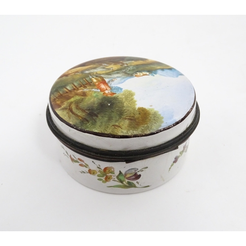 1284 - A 19thC enamel box of circular form with hand painted decoration depicting a country landscape with ... 