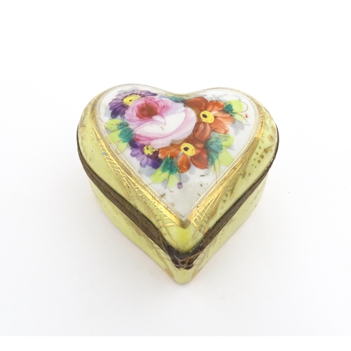 1285 - A 19thC porcelain trinket box of heart form with hand painted floral decoration. Approx. 2 1/4