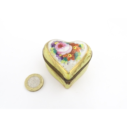 1285 - A 19thC porcelain trinket box of heart form with hand painted floral decoration. Approx. 2 1/4