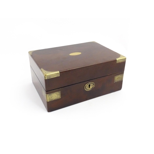 1288 - A 19thC brass bound mahogany vanity / dressing box with a fitted interior with glass dressing table ... 