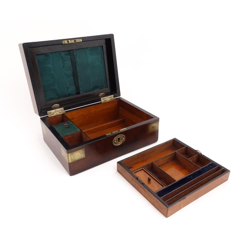 1288 - A 19thC brass bound mahogany vanity / dressing box with a fitted interior with glass dressing table ... 