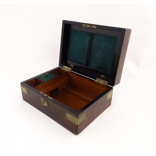 1288 - A 19thC brass bound mahogany vanity / dressing box with a fitted interior with glass dressing table ... 