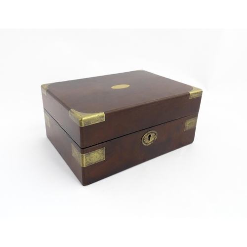 1288 - A 19thC brass bound mahogany vanity / dressing box with a fitted interior with glass dressing table ... 