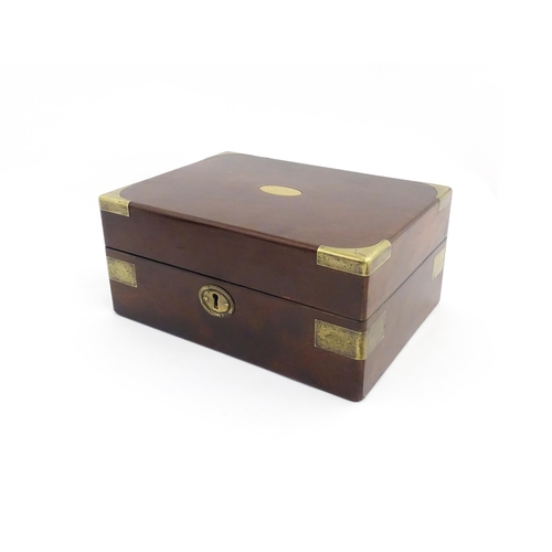 1288 - A 19thC brass bound mahogany vanity / dressing box with a fitted interior with glass dressing table ... 