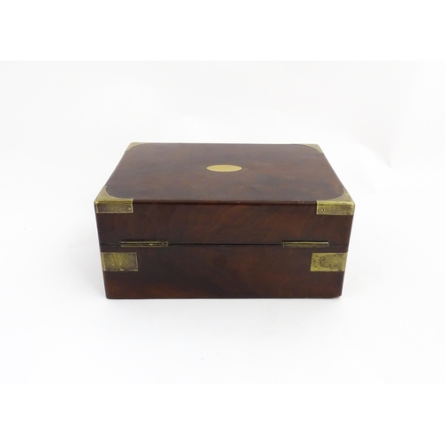 1288 - A 19thC brass bound mahogany vanity / dressing box with a fitted interior with glass dressing table ... 