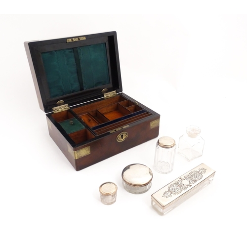 1288 - A 19thC brass bound mahogany vanity / dressing box with a fitted interior with glass dressing table ... 