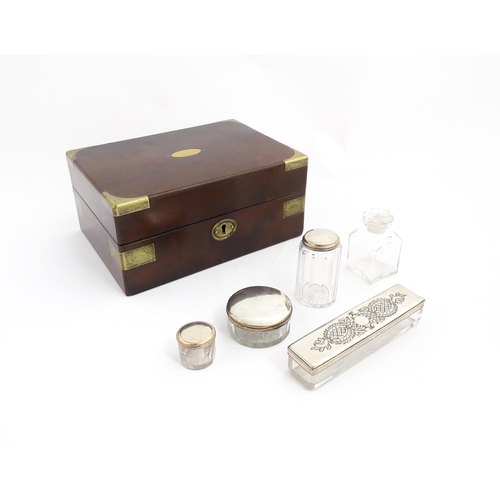 1288 - A 19thC brass bound mahogany vanity / dressing box with a fitted interior with glass dressing table ... 