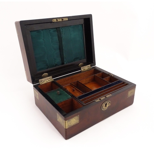 1288 - A 19thC brass bound mahogany vanity / dressing box with a fitted interior with glass dressing table ... 