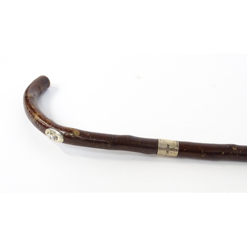 1295 - An early 20thC Brigg walking stick / cane with hallmarked silver collar, with concealed silver handl... 