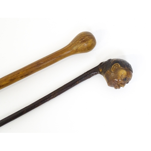 1296 - A 19thC novelty walking stick / cane with folk art / naive carved pommel modelled as the head of a m... 