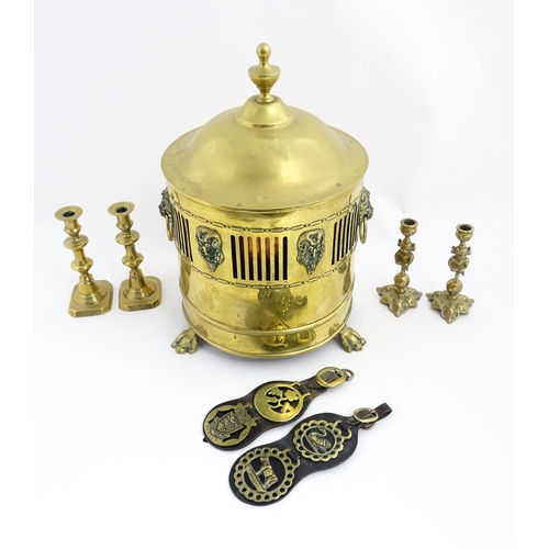 1298 - A quantity of brass items comprising coal bucket , two pairs of candlesticks and two horse brasses w... 