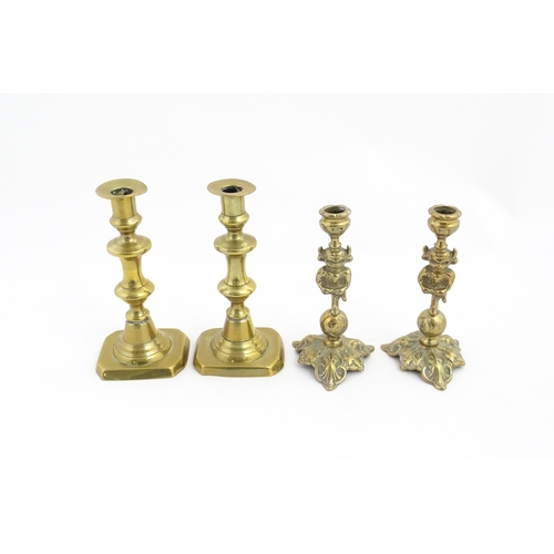 1298 - A quantity of brass items comprising coal bucket , two pairs of candlesticks and two horse brasses w... 