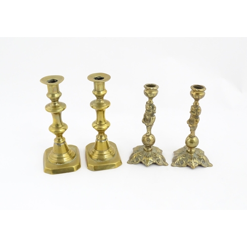 1298 - A quantity of brass items comprising coal bucket , two pairs of candlesticks and two horse brasses w... 