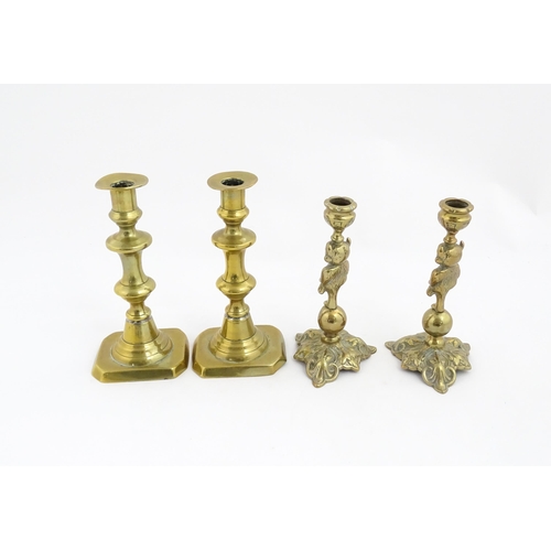 1298 - A quantity of brass items comprising coal bucket , two pairs of candlesticks and two horse brasses w... 