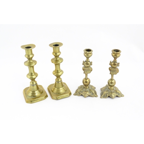 1298 - A quantity of brass items comprising coal bucket , two pairs of candlesticks and two horse brasses w... 