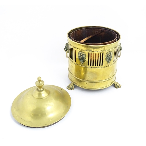 1298 - A quantity of brass items comprising coal bucket , two pairs of candlesticks and two horse brasses w... 