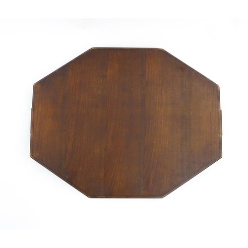 1300 - A 19thC yew wood tray of rectangular form with shaped gallery. Together with another of octagonal fo... 