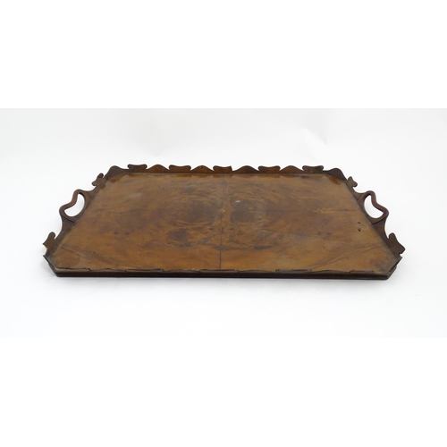 1300 - A 19thC yew wood tray of rectangular form with shaped gallery. Together with another of octagonal fo... 