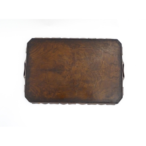 1300 - A 19thC yew wood tray of rectangular form with shaped gallery. Together with another of octagonal fo... 