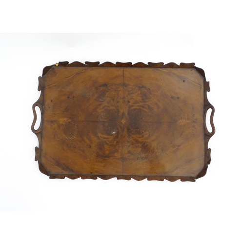 1300 - A 19thC yew wood tray of rectangular form with shaped gallery. Together with another of octagonal fo... 