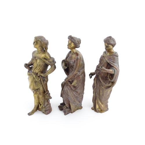 1313 - Three 19thC cast bronze sculptures depicting Classical maidens to include one standing before an anv... 