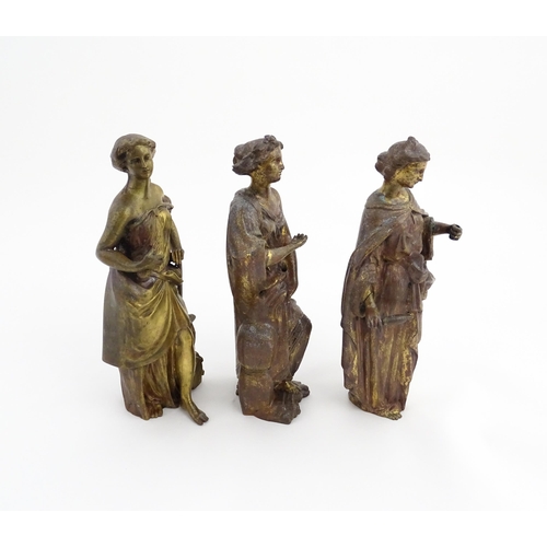 1313 - Three 19thC cast bronze sculptures depicting Classical maidens to include one standing before an anv... 