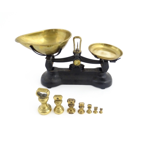 1315 - Early 20thC cast iron and brass Libra Scale Co. balance scales. Together with seven brass weights. S... 