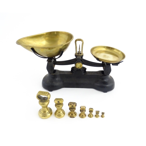 1315 - Early 20thC cast iron and brass Libra Scale Co. balance scales. Together with seven brass weights. S... 