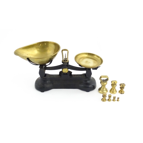 1315 - Early 20thC cast iron and brass Libra Scale Co. balance scales. Together with seven brass weights. S... 