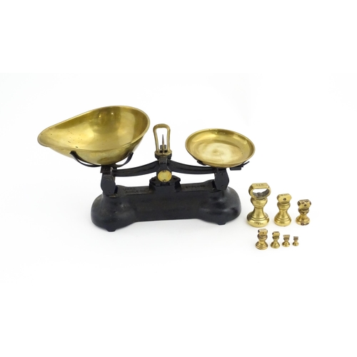 1315 - Early 20thC cast iron and brass Libra Scale Co. balance scales. Together with seven brass weights. S... 