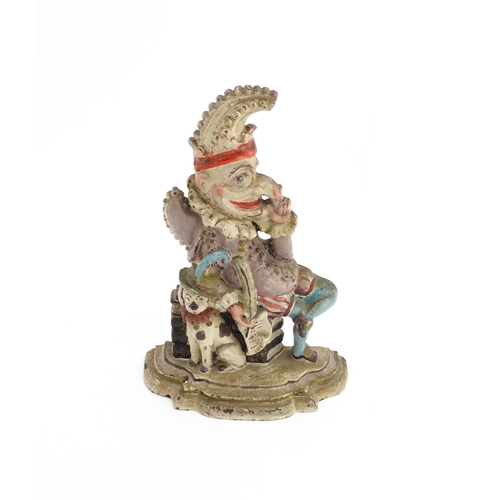 1317 - A cast door stop / door porter modelled as Mr Punch and Toby the dog, with polychrome decoration. Ap... 