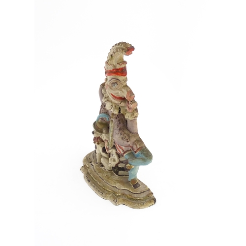 1317 - A cast door stop / door porter modelled as Mr Punch and Toby the dog, with polychrome decoration. Ap... 