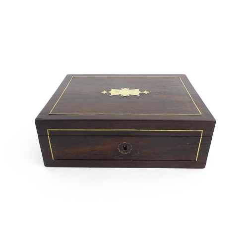 1319 - An early 20thC rosewood box with brass stringing and shaped plaque to top. Approx. 3 1/2