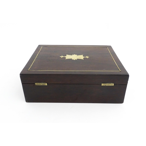 1319 - An early 20thC rosewood box with brass stringing and shaped plaque to top. Approx. 3 1/2