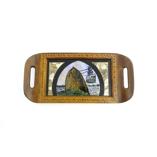 1320 - A 20thC Brazilian twin handled tray set with central scene depicting a Rio de Janeiro view with butt... 