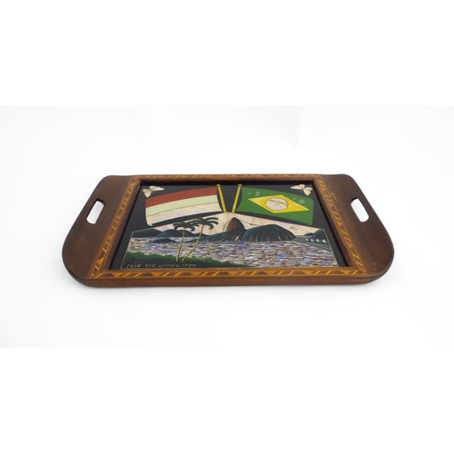 1320 - A 20thC Brazilian twin handled tray set with central scene depicting a Rio de Janeiro view with butt... 