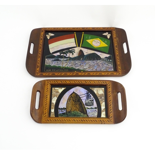 1320 - A 20thC Brazilian twin handled tray set with central scene depicting a Rio de Janeiro view with butt... 