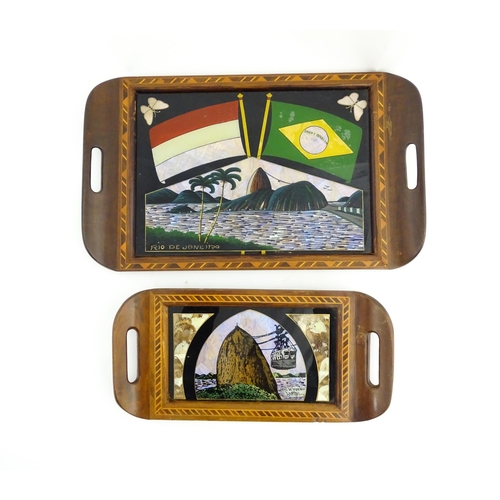 1320 - A 20thC Brazilian twin handled tray set with central scene depicting a Rio de Janeiro view with butt... 