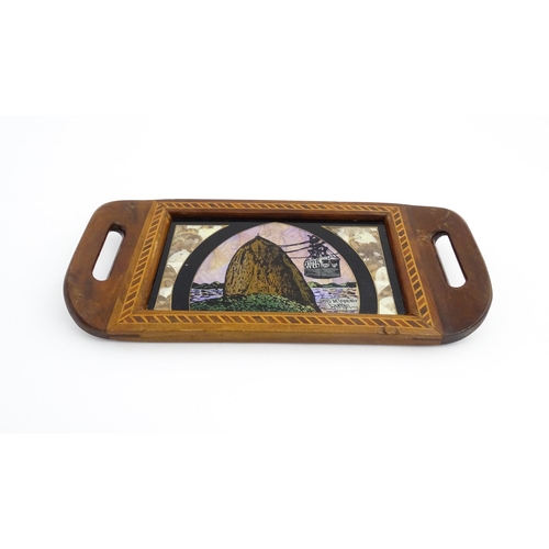 1320 - A 20thC Brazilian twin handled tray set with central scene depicting a Rio de Janeiro view with butt... 