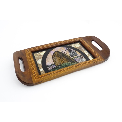 1320 - A 20thC Brazilian twin handled tray set with central scene depicting a Rio de Janeiro view with butt... 